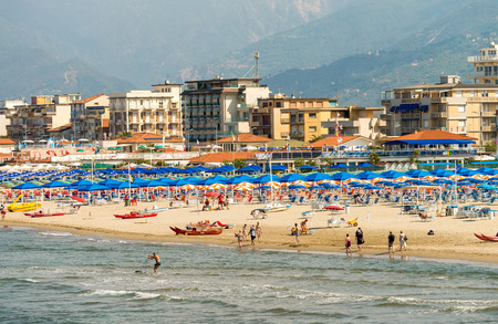 VIAREGGIO, ITALY - MAY 30, 2015: Row of beach umbrellas on private bathhouse. Viareggio is a famous destination in Tuscany.のeditorial素材