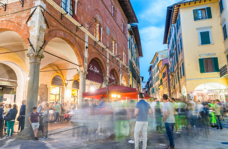 PISA - JUNE 16, 2015: Tourists and locals at night enjoy famous Luminara. This is a light show throughout the whole city.のeditorial素材