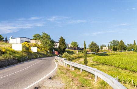 Tuscany, Italy. Rural sunset landscape. Countryside meadows, green field, sun light and clouds.の写真素材