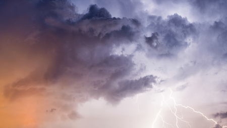Strong lightning against stormy sky.の写真素材