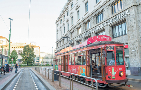 MILAN - SEPTEMBER 25, 2015: Historic tram rides in Milan. Milan transportation system carries 1.7 million passengers daily.のeditorial素材