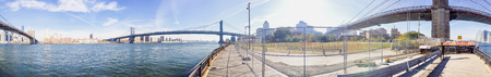 NEW YORK CITY - OCTOBER 2015: Tourists in Brooklyn Bridge Park. New York attracts 50 million...