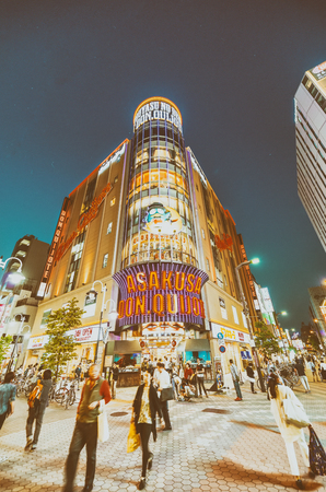 TOKYO - MAY 22, 2016: Asakusa streets and ads at night. Tokyo is visited by 15 million people every year.のeditorial素材