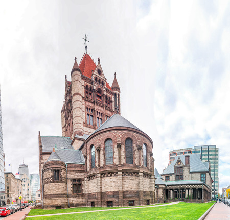 BOSTON - SEPTEMBER 2015: Trinity Church on a cloudy day. Boston attracts 10 million people annually.のeditorial素材