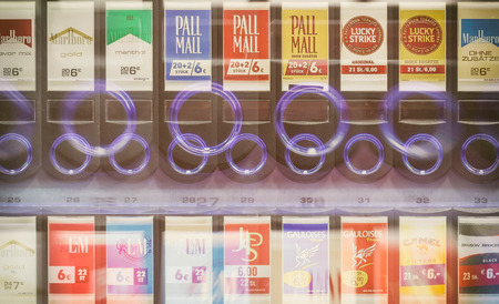 LEIPZIG, GERMANY - JULY 17, 2016: Cigarette vending machine on wall in street in inner city of Leipzig, Germany.のeditorial素材