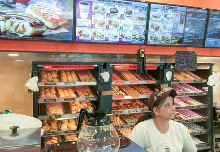 BOSTON - OCTOBER 2015: Dunkin Donuts shop interior. It is a major company serving breakfast.のeditorial素材
