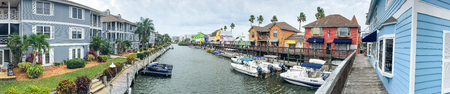 SIESTA BEACH, FL - FEBRUARY 2016: Panoramic view of colourful homes along canal. Siesta Beach is a famous destination in Florida.のeditorial素材