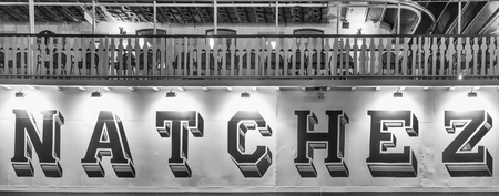 NEW ORLEANS - FEBRUARY 9, 2016: Natchez boat entrance sign at night docked along Mississippi River. Natchez Steamboat is a famous tourist attraction.のeditorial素材