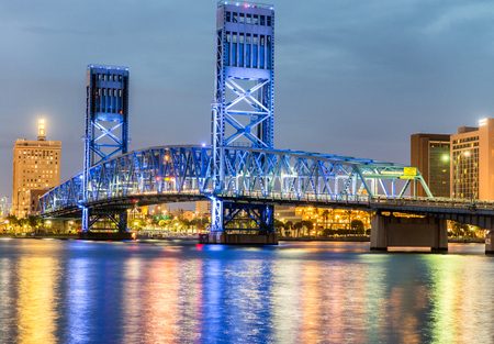 Jacksonville, Florida. City lights at night with bridge and river reflections.の写真素材