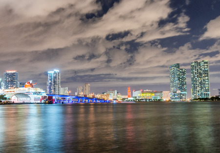Miami, Florida. City skyline at night with water reflections.の写真素材