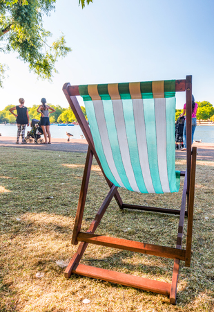 Empty chair in a city park. Relax concept.の写真素材