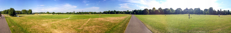 Tourists walk in Hyde Park, panoramic view, London.のeditorial素材
