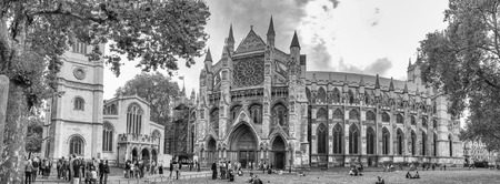 LONDON - SEPTEMBER 2016: Tourists walk near Westminster Abbey. London attracts 30 million people annually.のeditorial素材