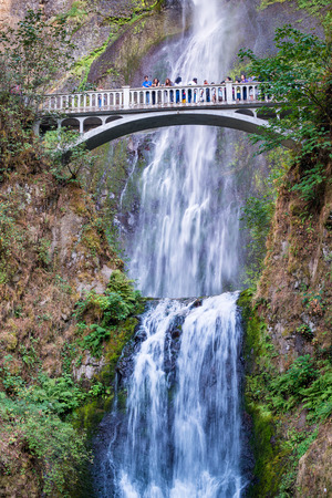 PORTLAND, OR - AUGUST 19TH, 2017: Tourists enjoy Multnomah Falls. It is a waterfall on the Oregon side of the Columbia River Gorge, along the Historic Columbia River Highway.のeditorial素材