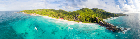 Panoranic aerial view of Grand and Petite Anse in La Digue, Seychelles.の写真素材