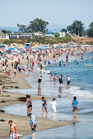 SANTA CRUZ, CA - AUGUST 4, 2017: People on the beach. This is a famous tourist attraction in California.のeditorial素材
