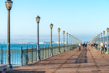 SAN FRANCISCO - AUGUST 6, 2017: Tourists on Embarcadero Pier. The city attracts 20 million people annually.のeditorial素材