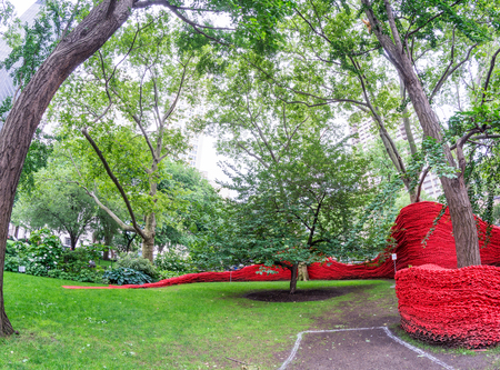 NEW YORK CITY - JUNE 2013: Tourists in Madison Square Park. New York attracts 50 million tourists every year.のeditorial素材