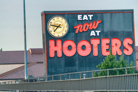 PORTLAND, OR - AUGUST 21, 2017: Hooters sign along city streets. It is part of a US based casual dining chain that has locations in several countries.のeditorial素材