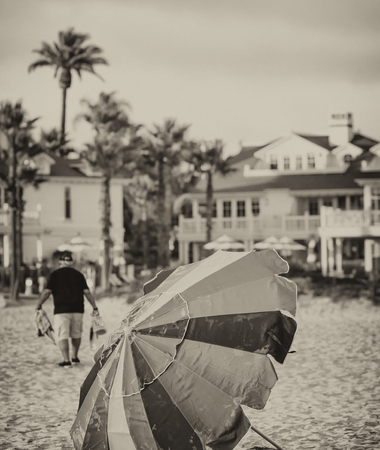 Colourful umbrella on a beautiful beach at sunset.の写真素材