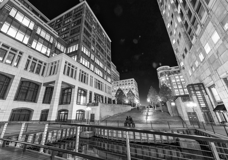 LONDON - JUNE 2015: Skyline of Canary Wharf skyscrapers at night. London attracts 30 million tourists annually.のeditorial素材