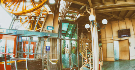 PARIS, FRANCE - DECEMBER 2012: Tourists visit Eiffel Tower. The city attracts 40 million people every year.のeditorial素材