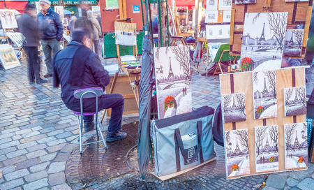 PARIS, FRANCE - DECEMBER 2012: Tourists visit Montmartre art district, long exposure shot. The city attracts 40 million people every year.のeditorial素材