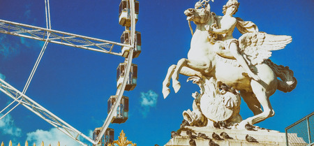Ferris wheel and statue in Paris, France.のeditorial素材