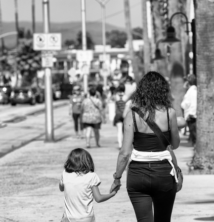 Mother and daughter along Santa Cruz Pier, CA.の写真素材