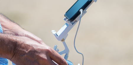 Man controlling his drone.