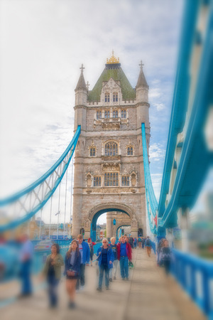 LONDON - SEPTEMBER 25, 2016: Tourists visit the Tower Bridge. London attracts 30 million people annuallyのeditorial素材