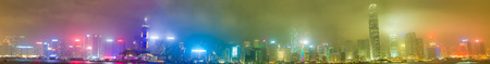 HONG KONG - APRIL 7, 2014: Panoramic skyline of the city after sunset. Hong Kong attracts 30 million...