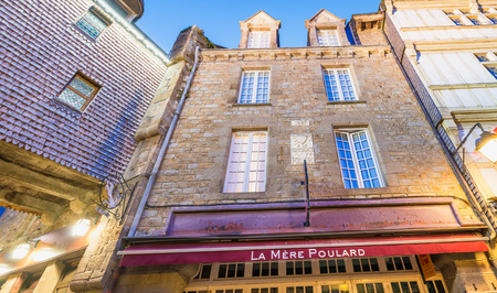 MONT SAINT MICHEL, FRANCE - JULY 2014: Tourists visit city medieval center. This is a major destination in France.のeditorial素材