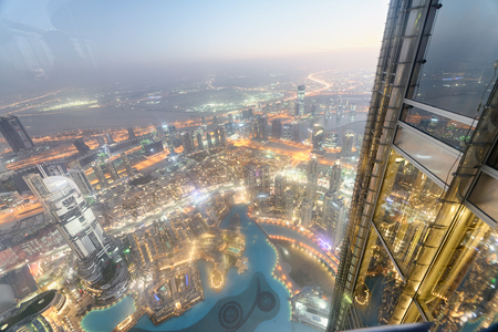 DUBAI - DECEMBER 4, 2016: Aerial view of Downtown Dubai at night. The city attracts 30 million tourists annually.のeditorial素材
