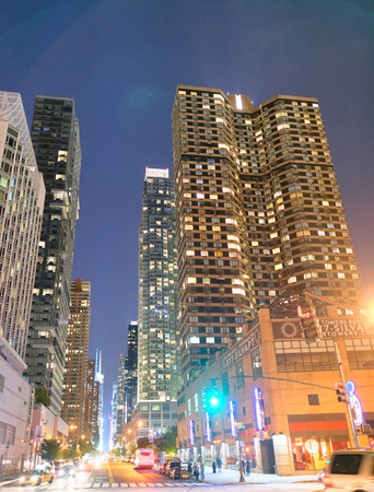 NEW YORK CITY - JUNE 14, 2013: Traffic in Midtown at night. New York attracts 50 million people every year.のeditorial素材