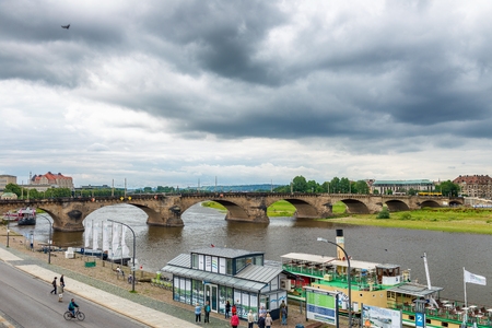 DRESDEN, GERMANY - JULY 15, 2016: Dresden Elba river and tourists. The city attracts 5 million tourists annually.のeditorial素材
