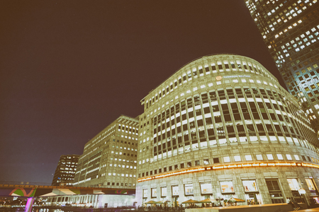 LONDON - MAY 2015: Canary Wharf skyscrapers at night. It is a major financial center in London.のeditorial素材