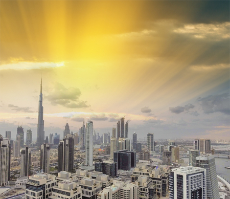 Downtown Dubai at sunset from city river, aerial view.のeditorial素材
