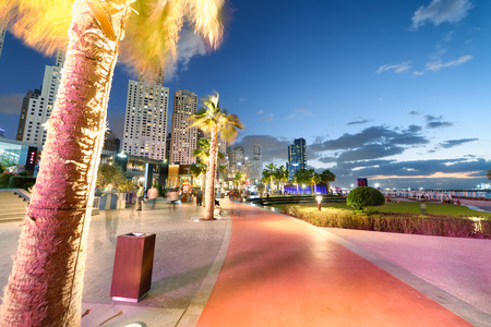DUBAI, UAE - DECEMBER 9, 2016: Dubai Marina skyline at night as seen from the promenade. The city attracts 30 million tourists annually.のeditorial素材