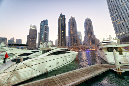 DUBAI - DECEMBER 5, 2016: Beautiful view of Dubai Marina skyline at night. The city attracts 30 million tourists annually.のeditorial素材