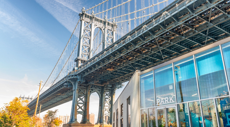 NEW YORK CITY - OCTOBER 22, 2015: Manhattan Bridge in Brooklyn. New York attracts 50 million people...