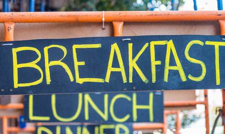 Breakfast, lunch and dinner street signs. Holiday, tourism and food concept.