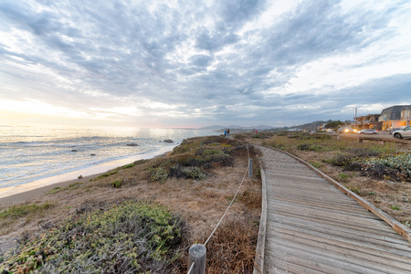 Cambria wooden walkway along the sea at sunset, California-USA.の写真素材