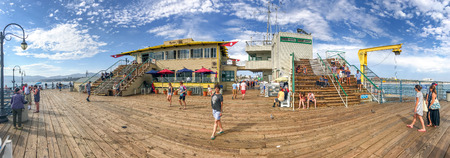 SANTA MONICA, CA - AUGUST 1, 2017: Tourists in Santa Monica Pier on a beautiful summer day. The pier contains Pacific Park, a family amusement park.のeditorial素材