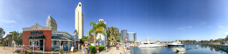 SAN DIEGO, CA - JULY 30, 2017: Tourists visit Seaport Village on a beautiful summer day. San Diego attracts 20 million tourists annually.のeditorial素材