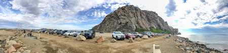 MORRO ROCK, CA - AUGUST 2, 2017: Tourists enjoy Morro Rock landscape. It is a major attraction in California.のeditorial素材