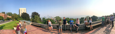 SEATTLE - AUGUST 8, 2017:Tourists enjoy cityscape view from Kerry Park. The city attracts 10 million...