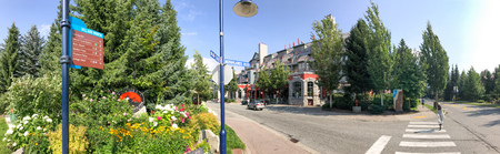 WHISTLER, CANADA - AUGUST 12, 2017: Tourists walk along city streets. Whistler is a famous winter...