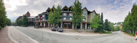 WHISTLER, CANADA - AUGUST 12, 2017: Tourists walk along city streets. Whistler is a famous winter skiing destination in Canada.のeditorial素材