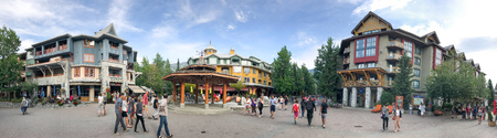 WHISTLER, CANADA - AUGUST 12, 2017: Tourists walk along city streets. Whistler is a famous winter...